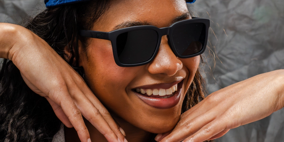 Woman wearing dark-tinted rectangular sunglasses